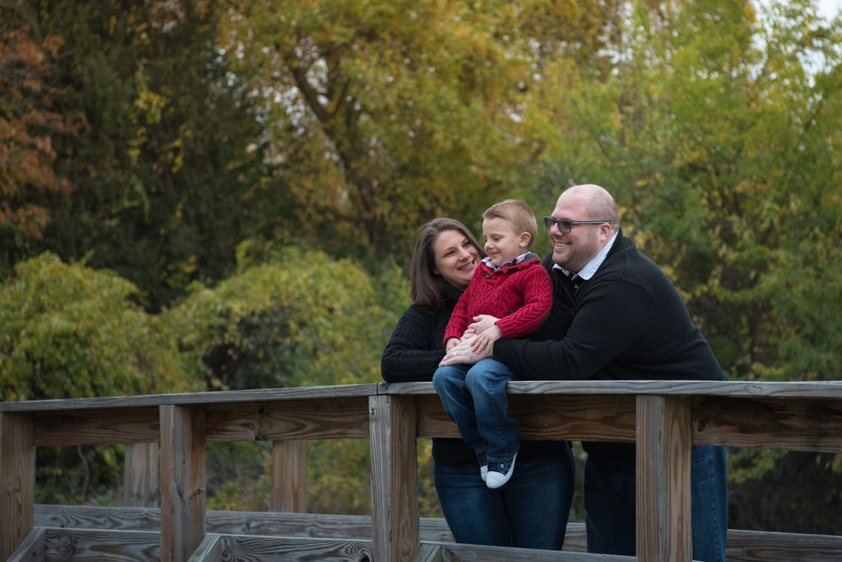 sweater wearing family on a bridge, South Lyon Family Photographer
