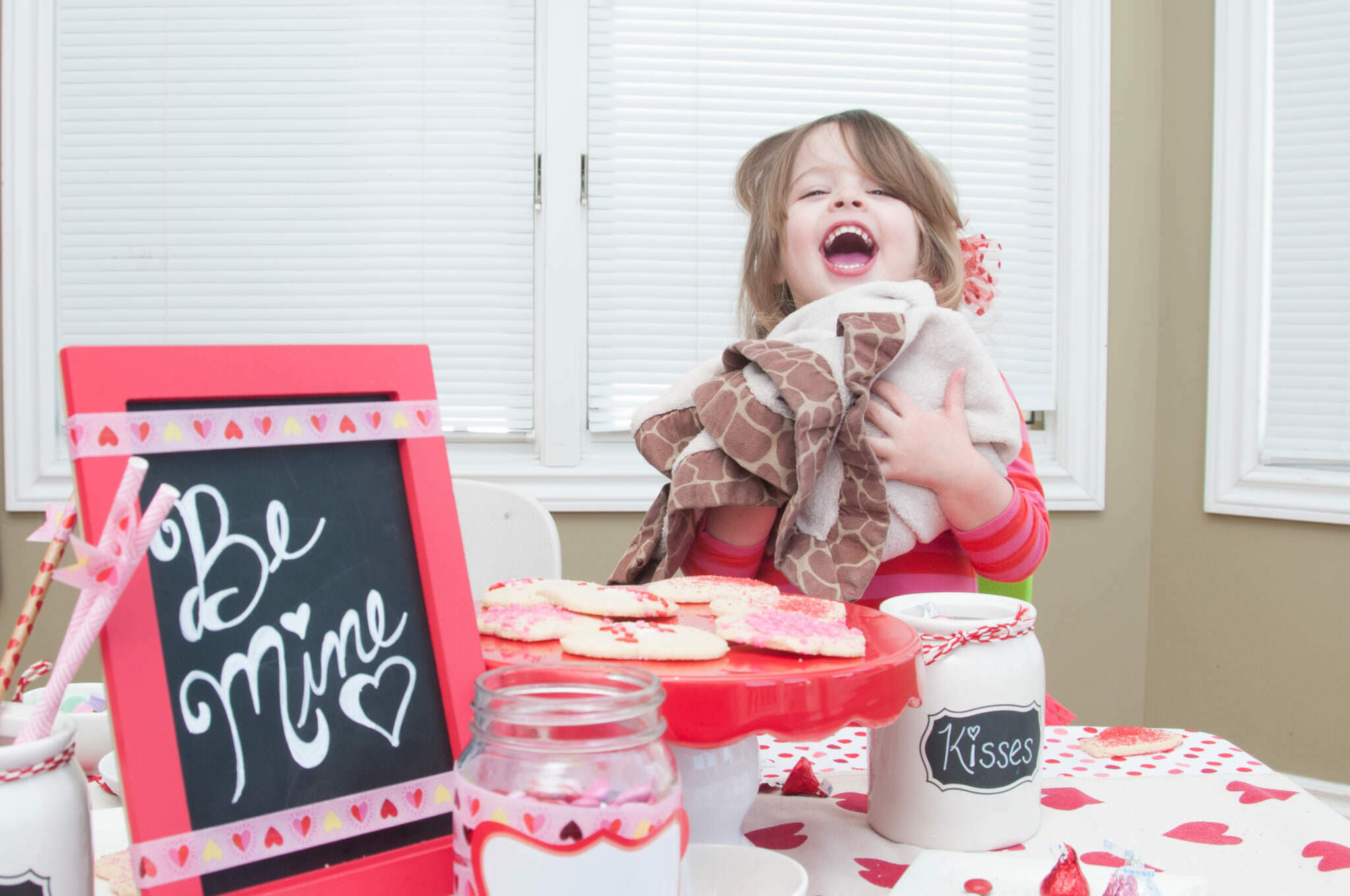 Laughing Girl holding blanket, Metro Detroit Child Photographer