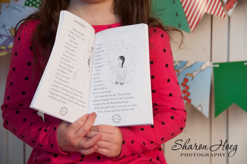 Girl holding a fairy book, South Lyon Child Photography