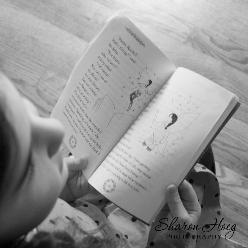 Young Girl holding a book open, Metro Detroit Child Photography