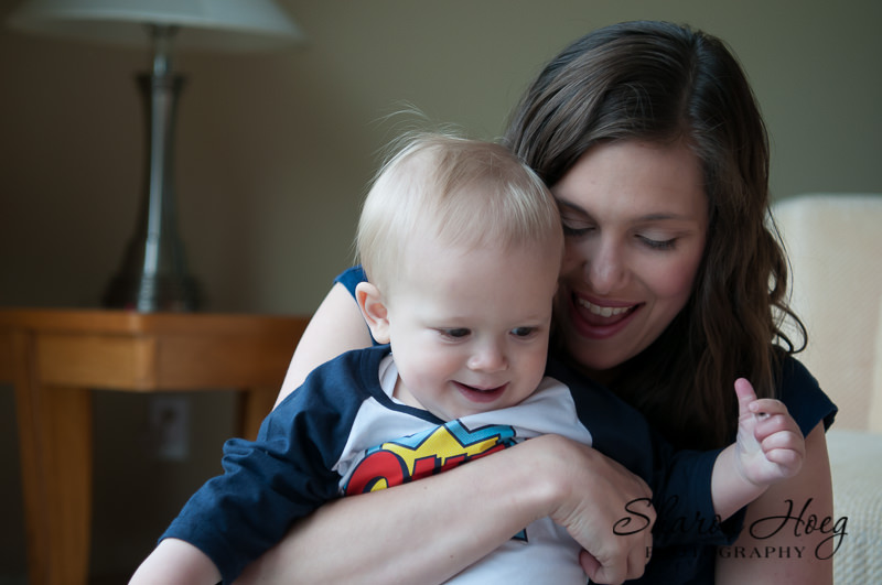 happy mom snuggling young boy, South Lyon Family Photographer