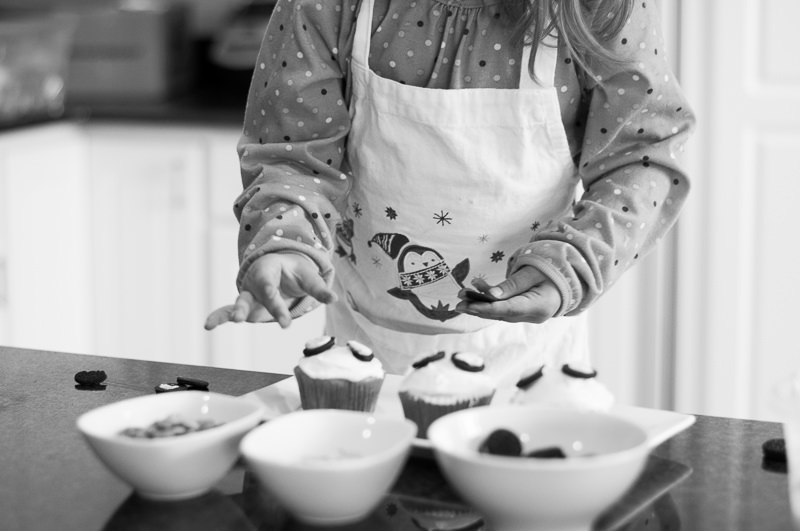 close up of child decorating cupcakes, Livonia Child Photographer