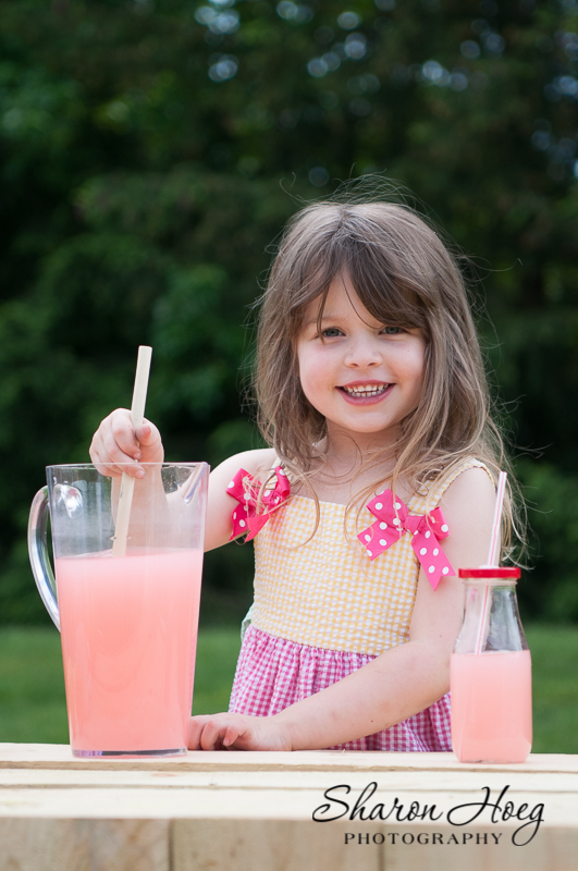 little girl stirring pink lemonade, plymouth photography