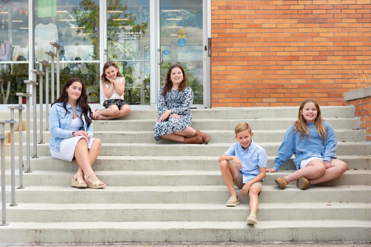 cousins family photography session on stairs in michigan