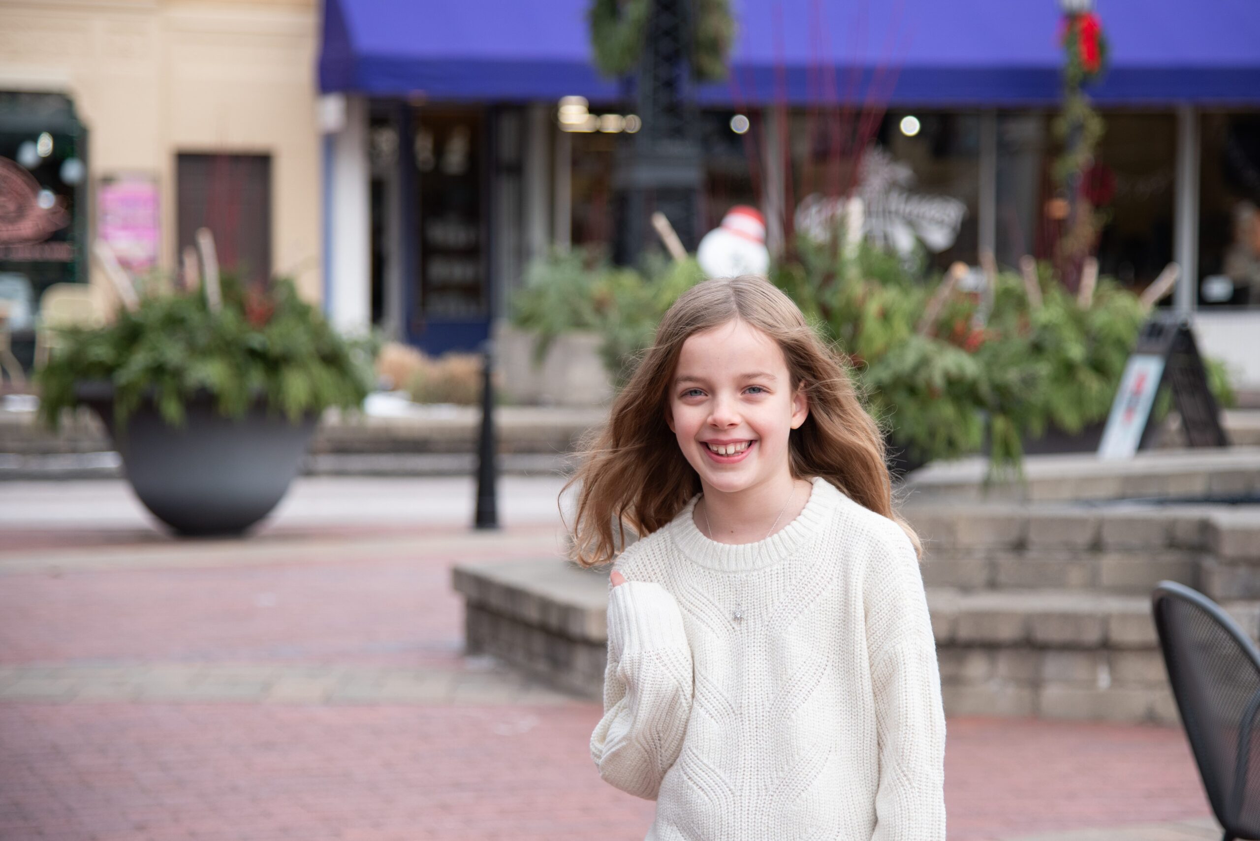 Happy girl smiling in downtown northville photography session